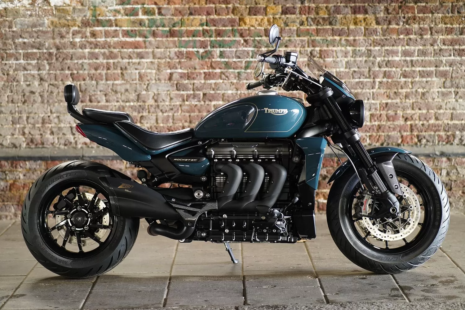 Charlie Stockwell Rifles Rocket 3GT custom Triumph. Heritage tribute motorcycle combining power, pride, and military-inspired styling.