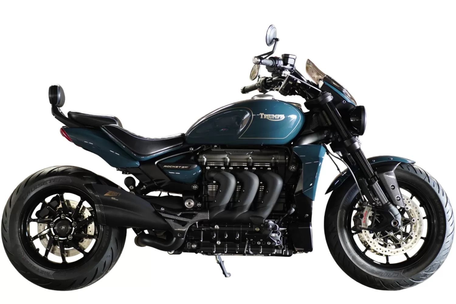 Rifles Rocket 3GT custom Triumph by Stockwell Design. A military-inspired build with bespoke paintwork, Zard carbon exhaust, and Diamond Drip saddle.