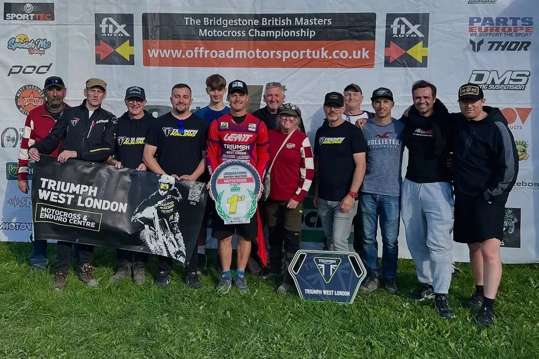 Josh Spinks with the Triumph West London team at Foxhill after securing the 2025 Bridgestone British Masters Pro Championship on the TF 450-RC.