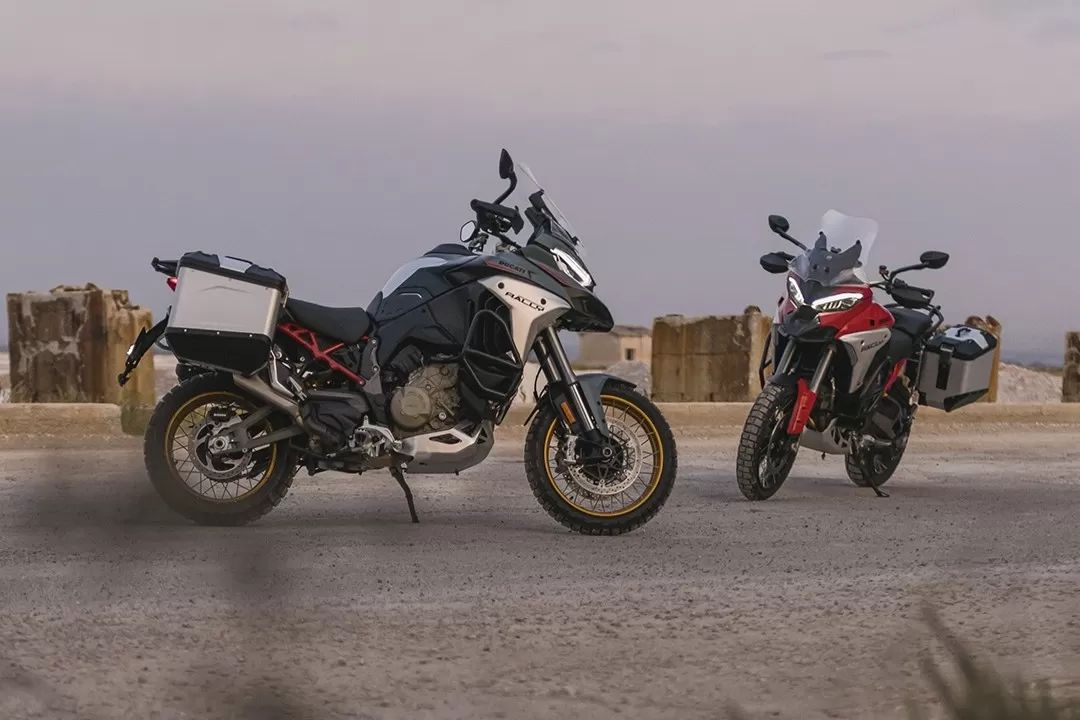 Two Ducati Multistrada V4 Rally motorcycles displayed side by side in different colour options.