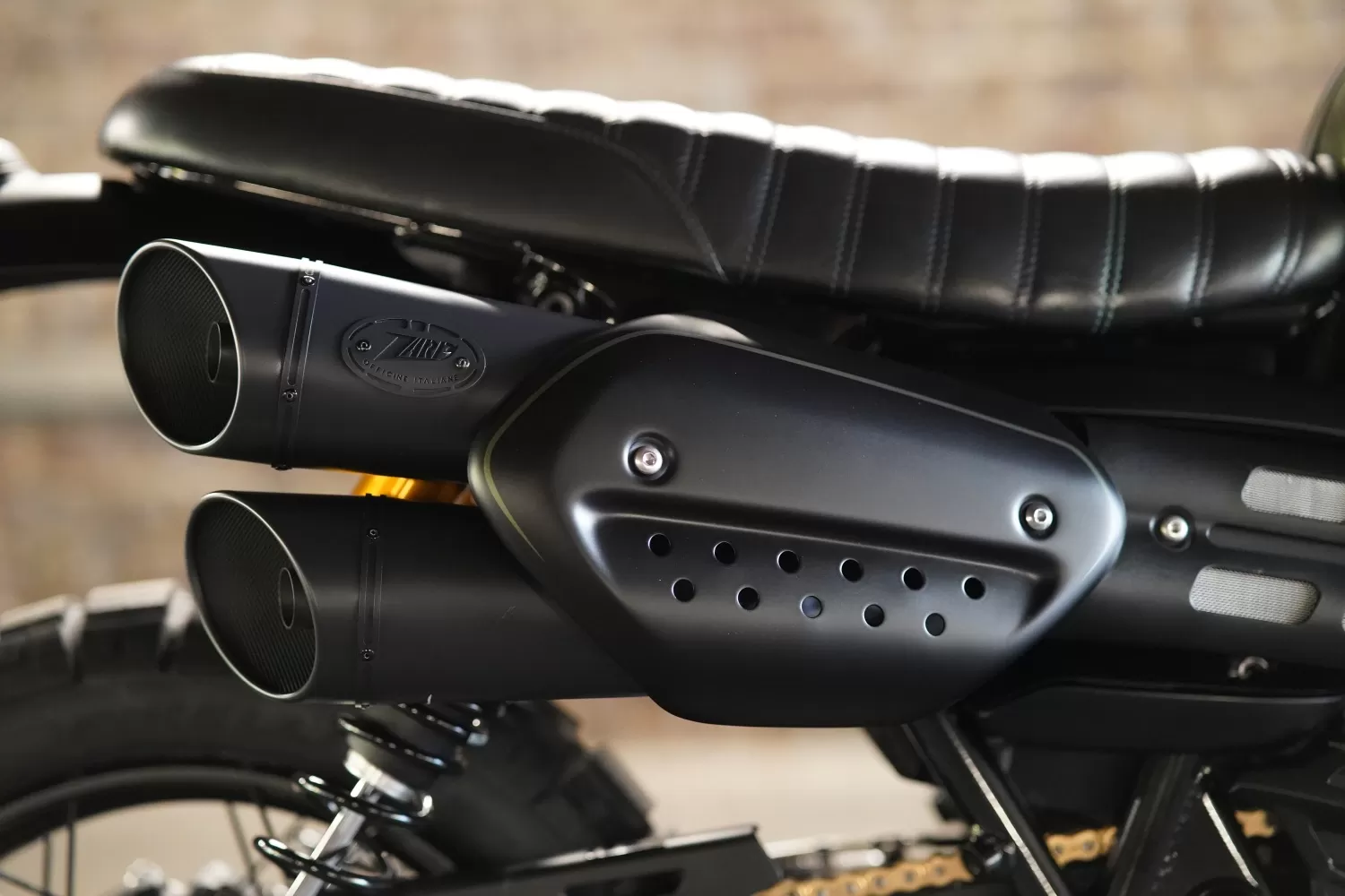 Detail of the Cerakote-black Zard 2-into-2 exhaust on The Pine Scrambler custom Triumph Scrambler.