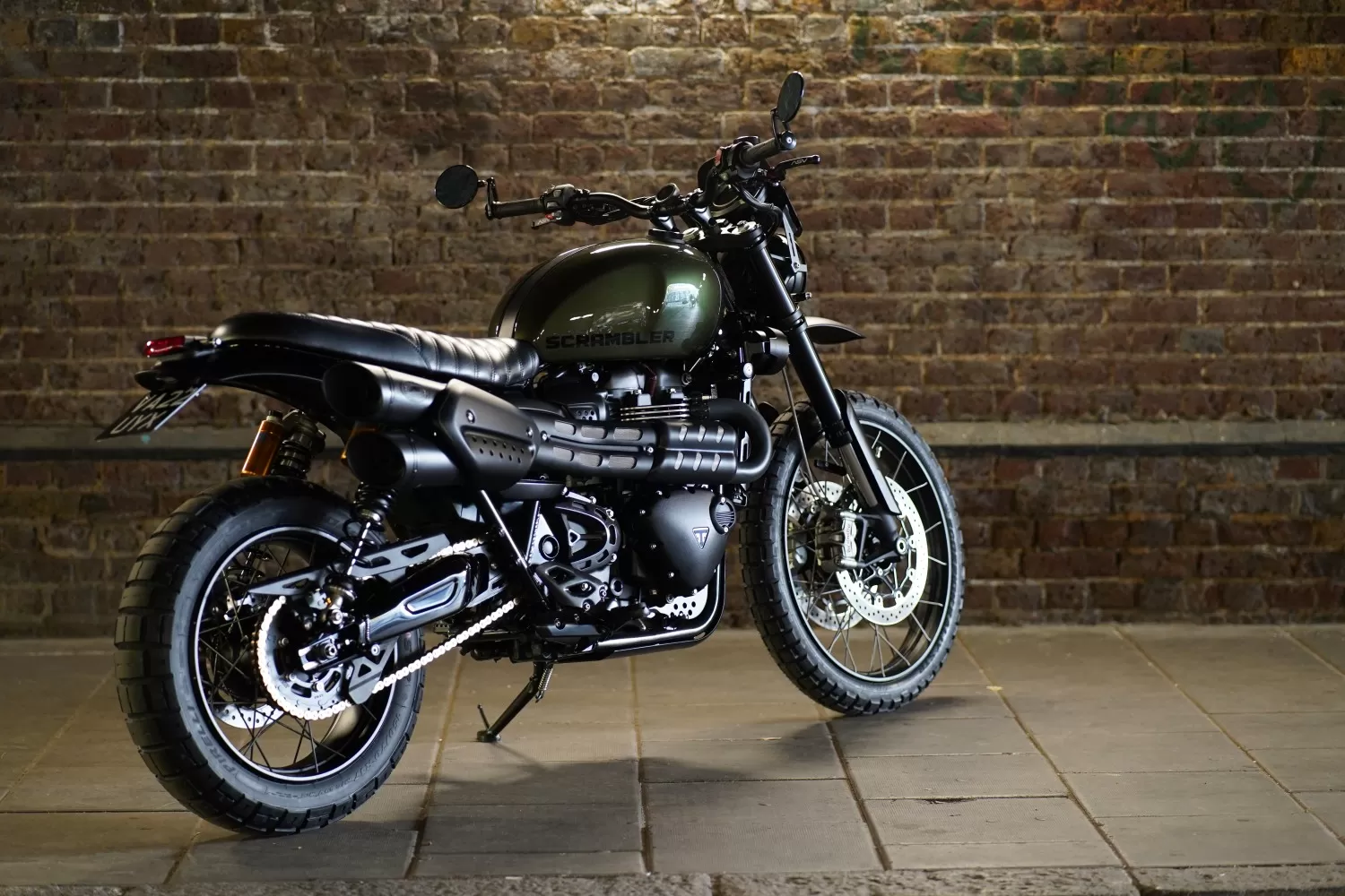 Alternate angle of The Pine Scrambler custom Triumph by Triumph London x Stockwell Design beneath the Vauxhall railway arch.