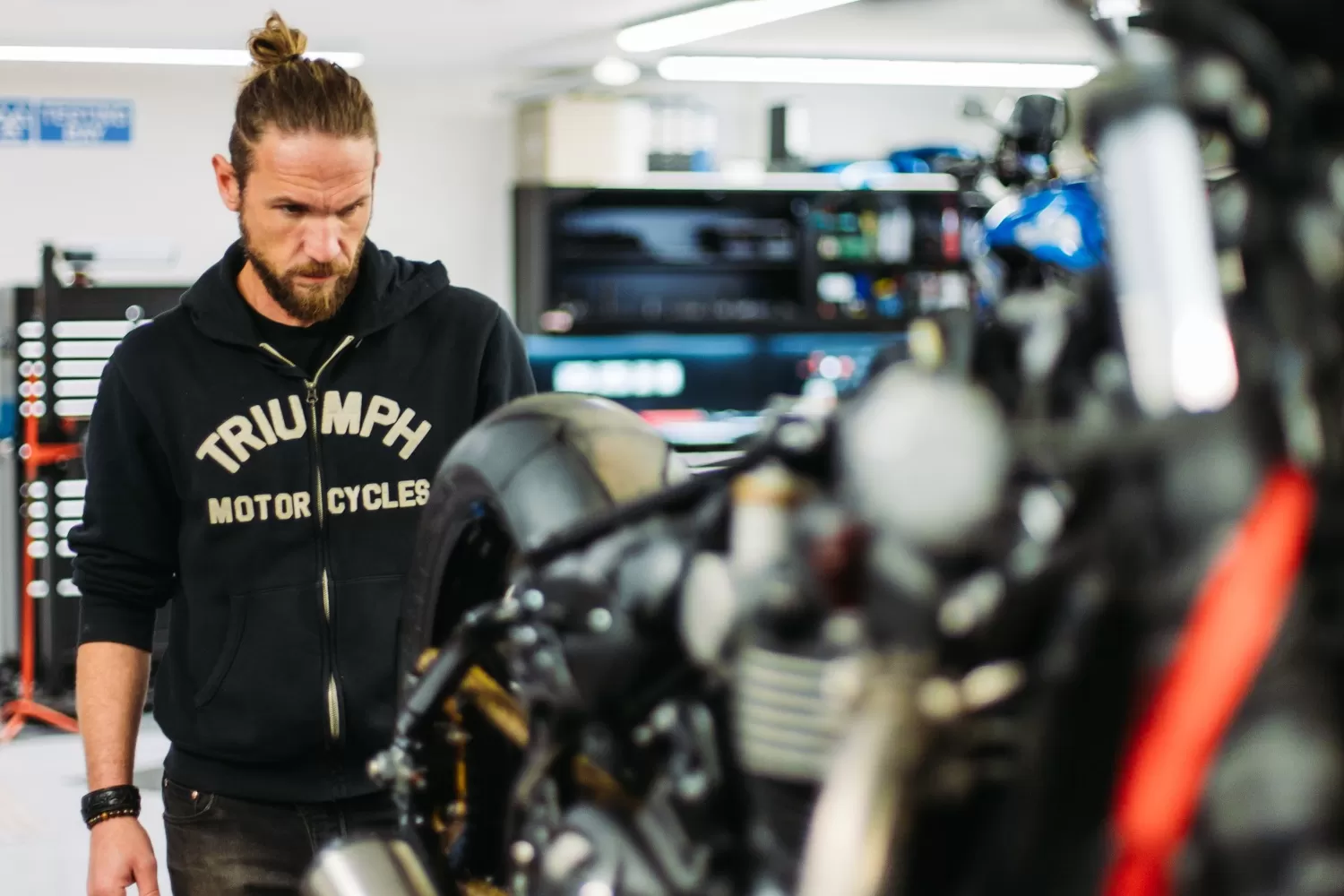 Charlie Stockwell with the Bobber RR mid-build in the Triumph West London workshop