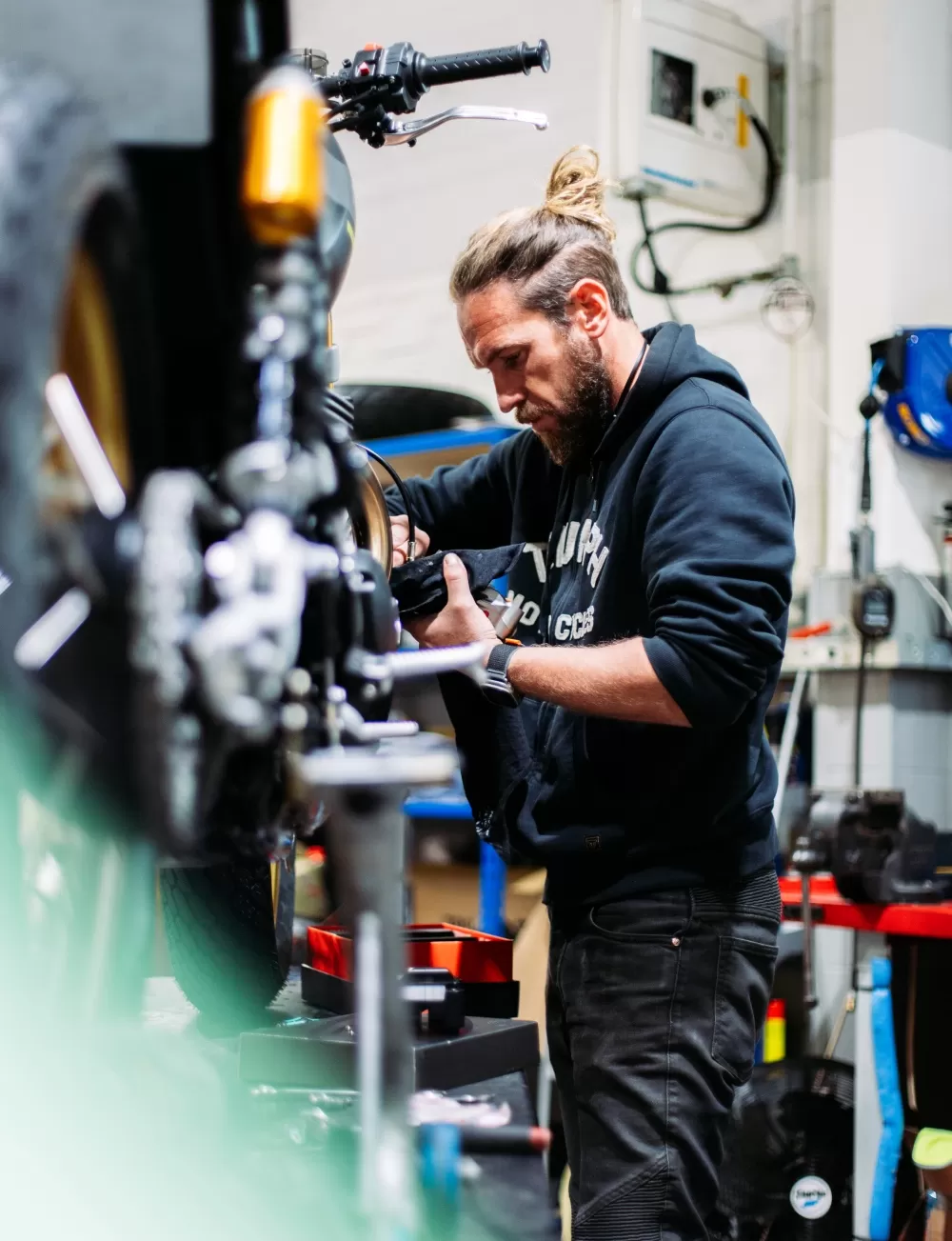 Charlie Stockwell of Stockwell Design Working in Triumph East London Workshop